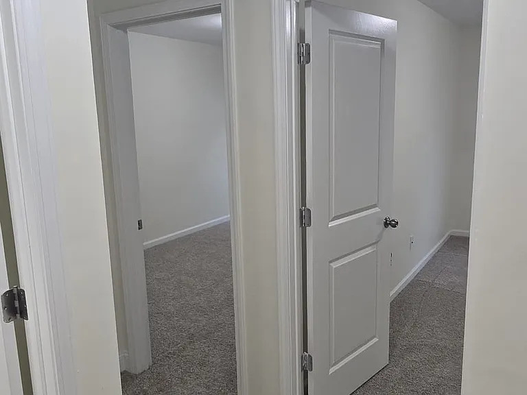 Rooms 1 and 2 directly across the staircase leading to the second floor
