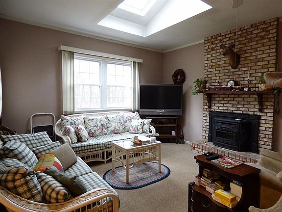 Family room with skylight & pellet stove/fireplace