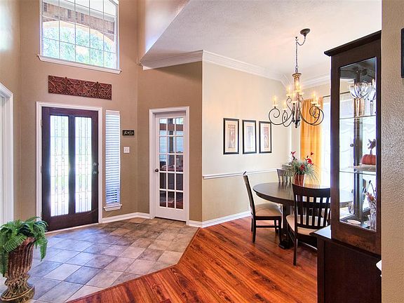More closely inspecting the detail of the entry provides even more appreciation, doesn't it?  The 15-light door leads into the study, with an open formal area that could provide additional flex space.
