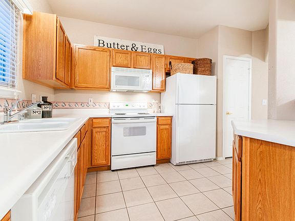 Spacious Kitchen with pantry and equipped with stove, refrigerator, microwave, dishwasher and garbage disposal