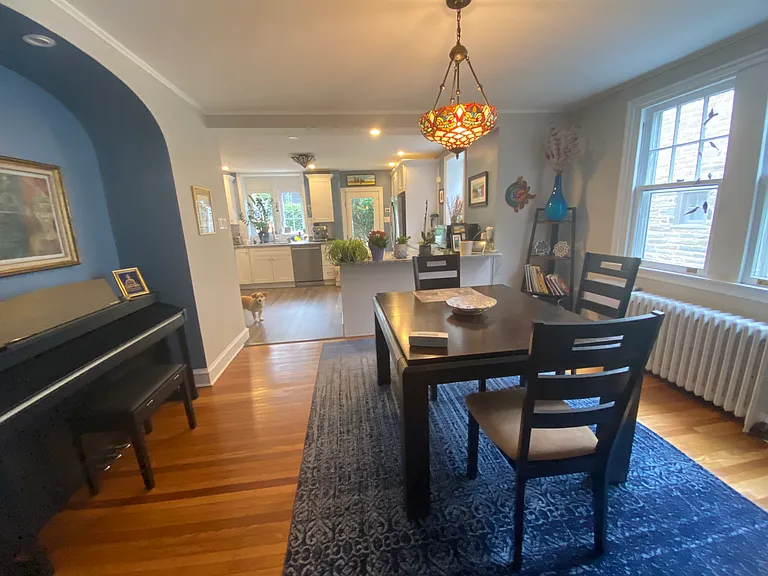 dining room with alcove and tiffany inspired fixture
