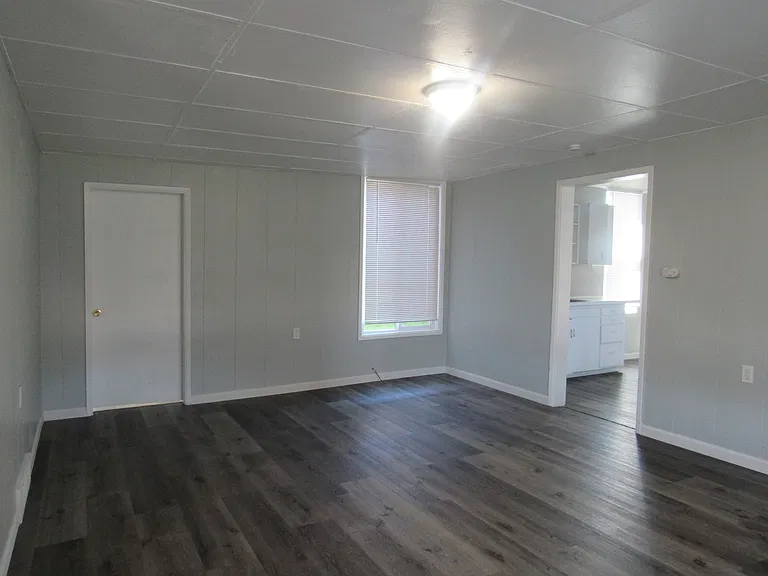 Living Room Dining area closed door to main floor bedroom