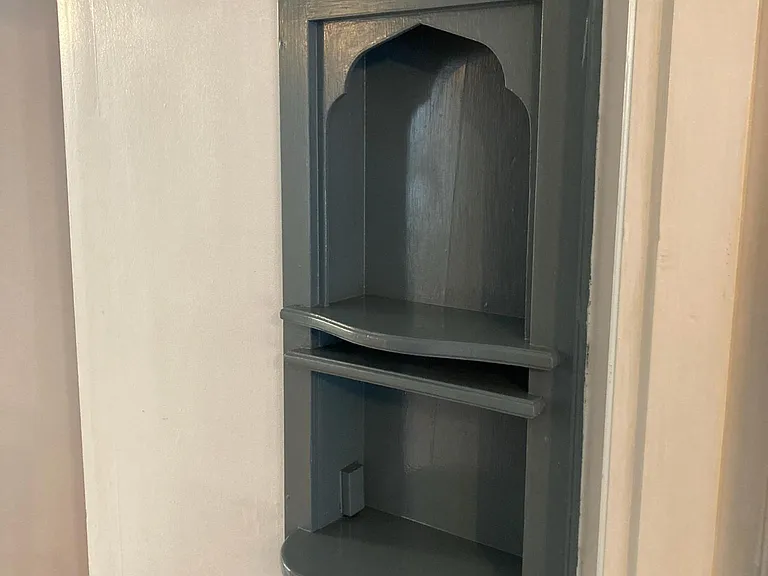 Built-in telephone niche in hallway.