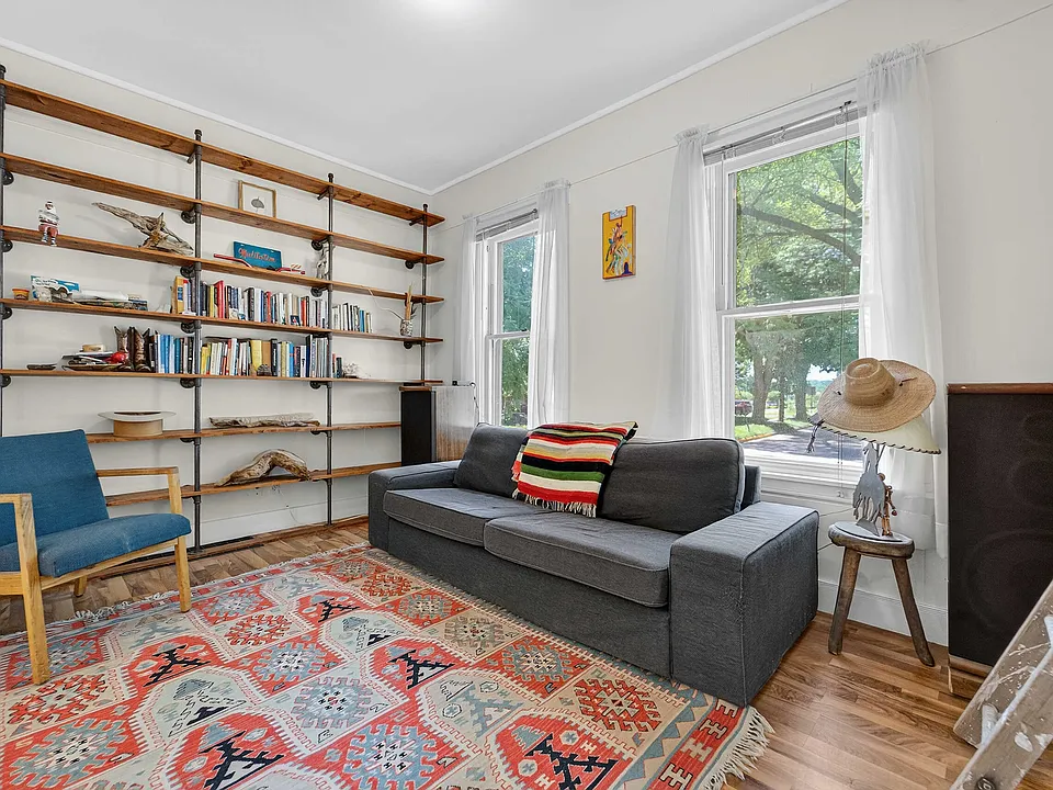 Readers Paradise with floor to ceiling bookshelves in living room!!