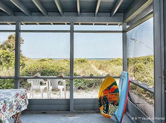 Line up your boogie boards on our outdoor screened porch.