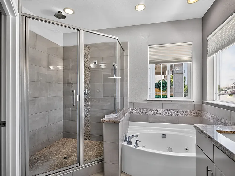 Masterbath with walk-in shower, custom body sprays. Soaking jetted tub.
