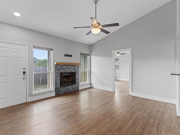 Living room. Door on the right is the primary bedroom.