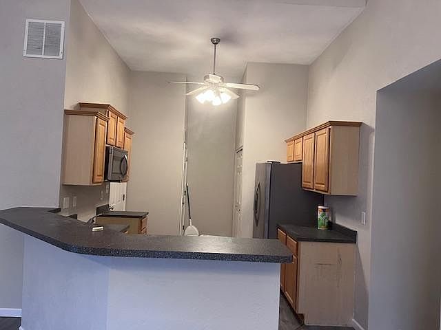 Kitchen with bar top counter
