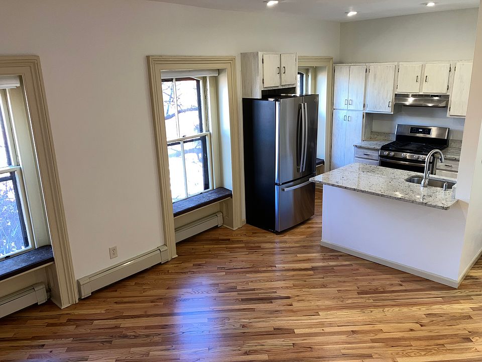 Kitchen view including three large original windows typical of the middle 1800s.