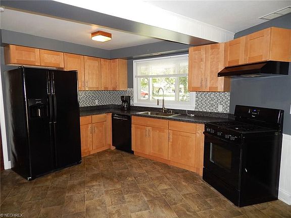 Updated cabinets, mosaic tile