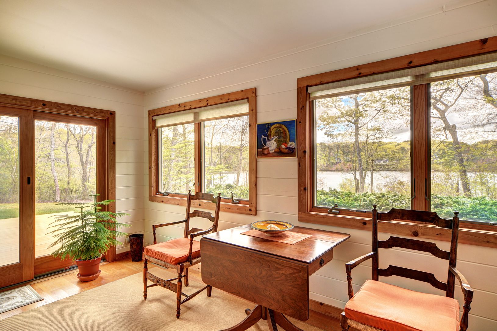  Reading Room with Sliding Glass Doors Opening up to Deck with Path to the Pond & Dock