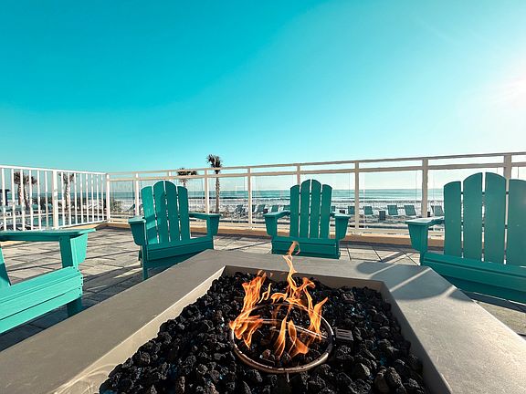 Relax by the fire and soak in the soothing sounds of ocean waves_the perfect escape for tranquility and connection.