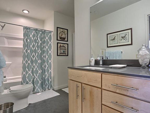 Modern bathrooms with ample space and luxurious fixtures and finishes.