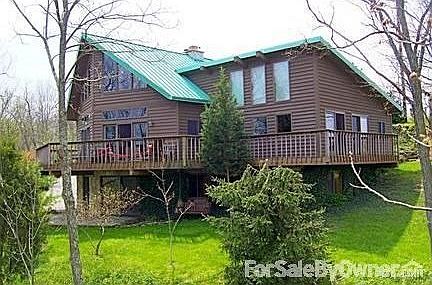 From northeast : View of house from river side. Photo taken from 40 feet up a tree.