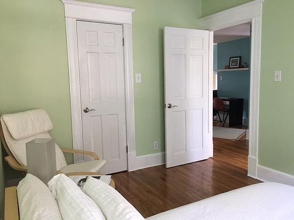 Identical spacious bedrooms with large windows and walk-ins.