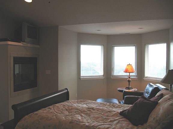 Luxurious master suite with 2 way fireplace, vaulted ceilings, 4 mountain views and a sitting area