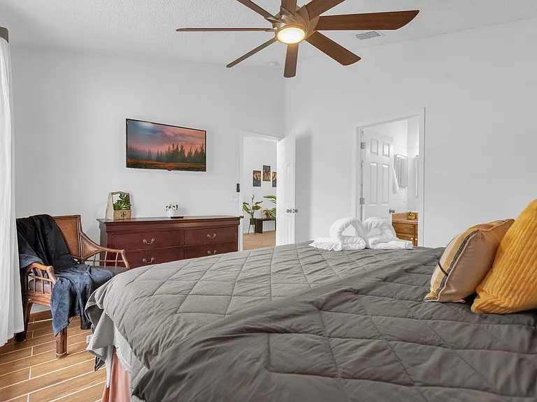 Master bedroom with King bed and chair
