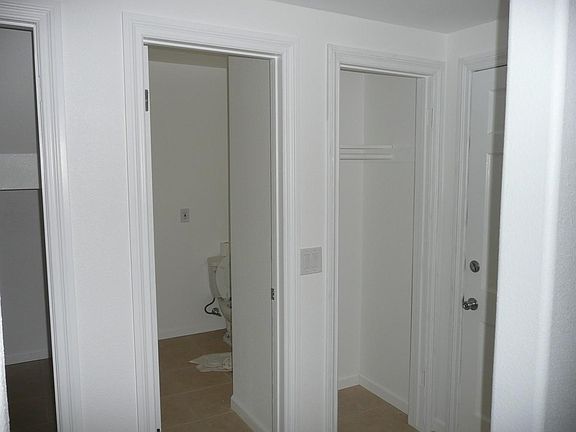 Entrance Hall. Closet and 1/2 bath on left.