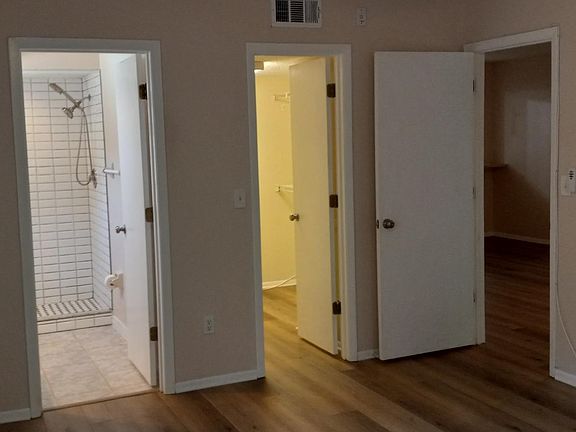 View from Master bedroom to master bath, walk-in closet, living room