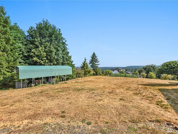 14x14x30 RV cover.  There is a gate to the right of driveway for access through yard to this.
