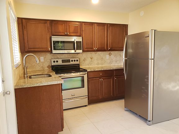 Kitchen with granite countertops and stainless steel appliances