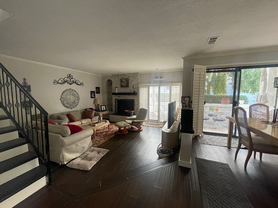 Living room with gas fireplace, pool and spa right outside