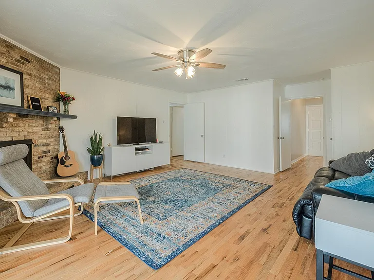 Nice size master bedroom with a ceiling fan and 2 closets.
