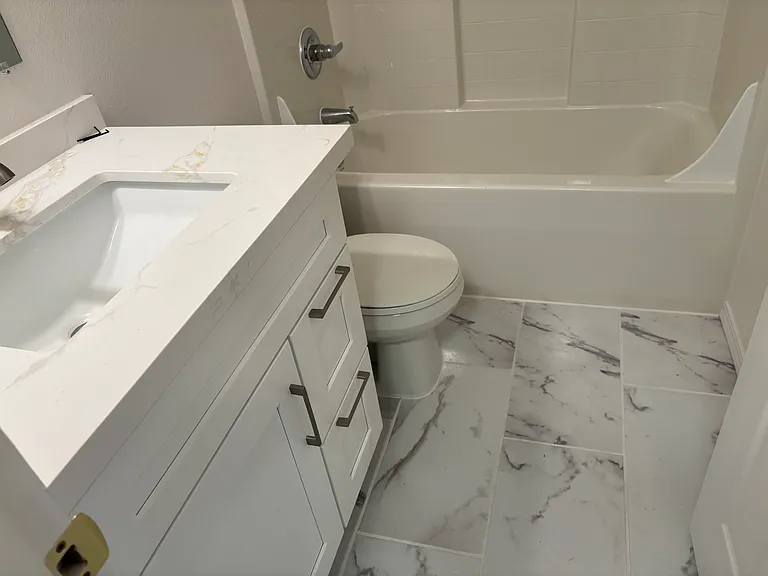 Full bath in Master Bedroom No. 2, new Quartz Counter, faucet and beautiful new 
ceramic flooring