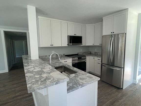 Kitchen w/ view of bar