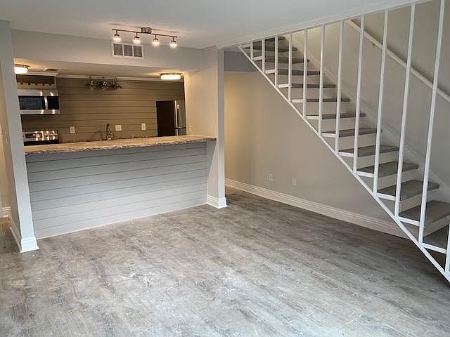 Freshly painted, modern looking floating staircase