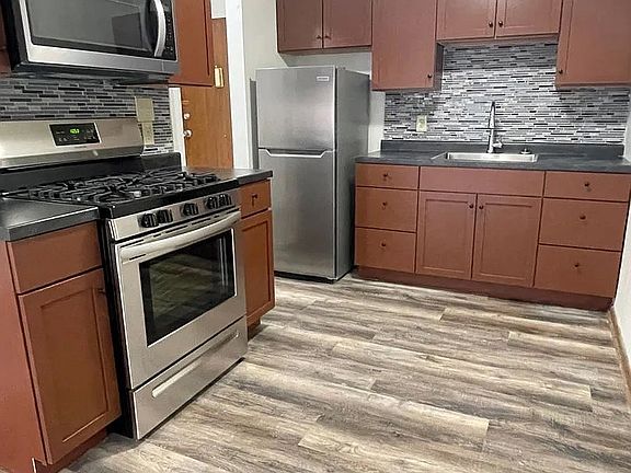 Elevate your culinary experience in this beautifully designed kitchen at LS Capital Group. Featuring stainless steel appliances, sleek countertops, and modern finishes, this space is perfect for culinary enthusiasts. Schedule a tour today!