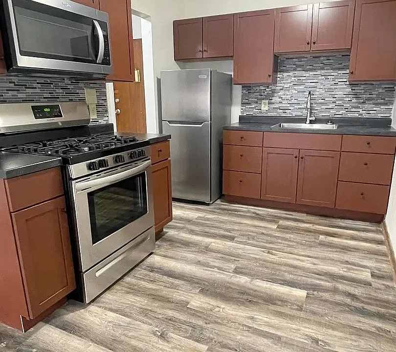 Elevate your culinary experience in this beautifully designed kitchen at LS Capital Group. Featuring stainless steel appliances, sleek countertops, and modern finishes, this space is perfect for culinary enthusiasts. Schedule a tour today!