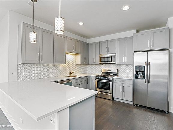 New kitchen with SS appliances and quartz countertops