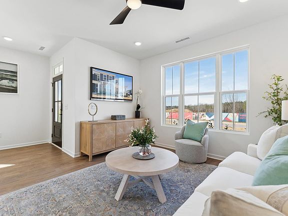 The family room of the Morgan townhome model by Brookfield Residential at Wendell Falls.