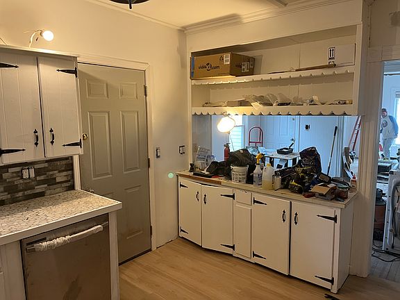 Kitchen w view of rear fire door.