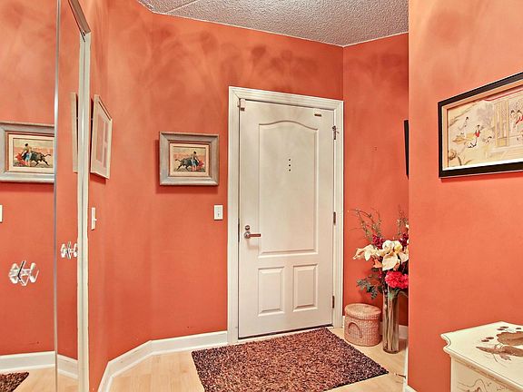 The welcoming foyer of unit #415 has a roomy guest