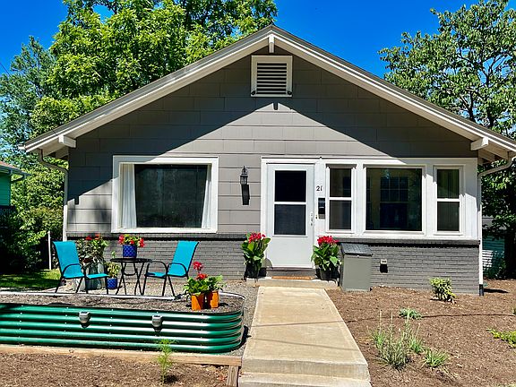 Fence has been installed around front patio seating area. Yard is gradually being filled in with native perennials to support native birds and insects.