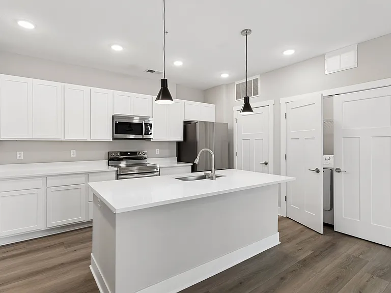 Large kitchen with island of an apartment home at Tiffany Flats.