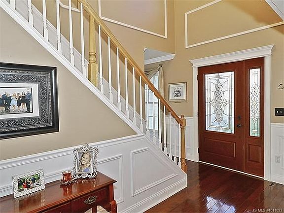 Foyer with Bruce Hardwood Floors and Custom Front Door