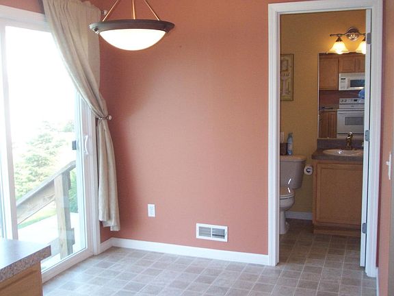 Eating area, half bath and pantry area.