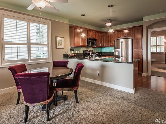 Dining room just off the chef's kitchen complete with ceiling fan and built in shutters.