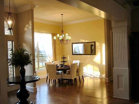 Wood floors make flow to Dining Area pleasing.