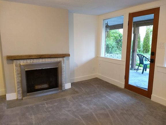 Living room with views of the lake and fireplace