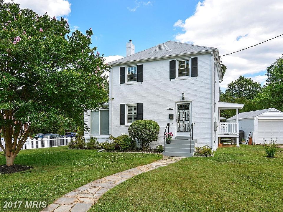 Brick~Exterior Home~with slate walkway.