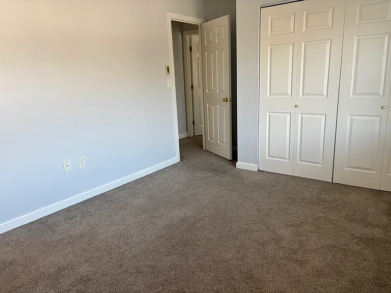 Unit 410 - Primary bedroom with carpet