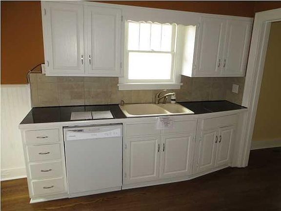 sink and dishwasher with granite countertops