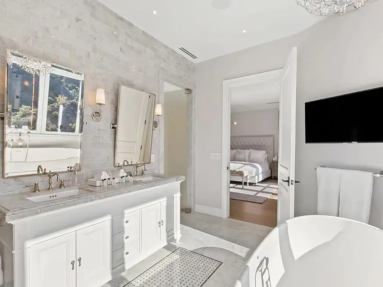 Master bathroom with stand alone soaking tub and his and hers sinks