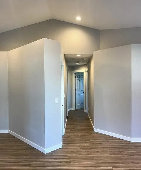 Hallway to bedrooms includes linen closet