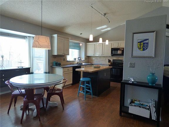 Kitchen with refinished cabinets, granite counter tops, composite sink and butch