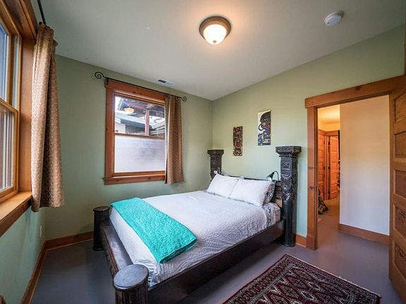 Bedroom #1 Solid queen size bed featuring 100% cotton sheets and duvet cover. Two windows let in ample light and mountain views.